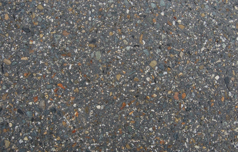 Charcoal Stone exposed aggregate concrete with deeper grey for contemporary finish