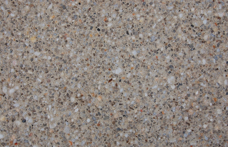 Coastal Stone exposed aggregate with soft neutral stone and light natural tones
