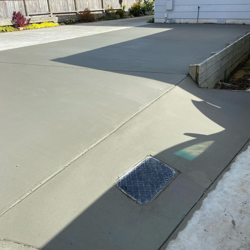 New plain concrete driveway at a residential home.
